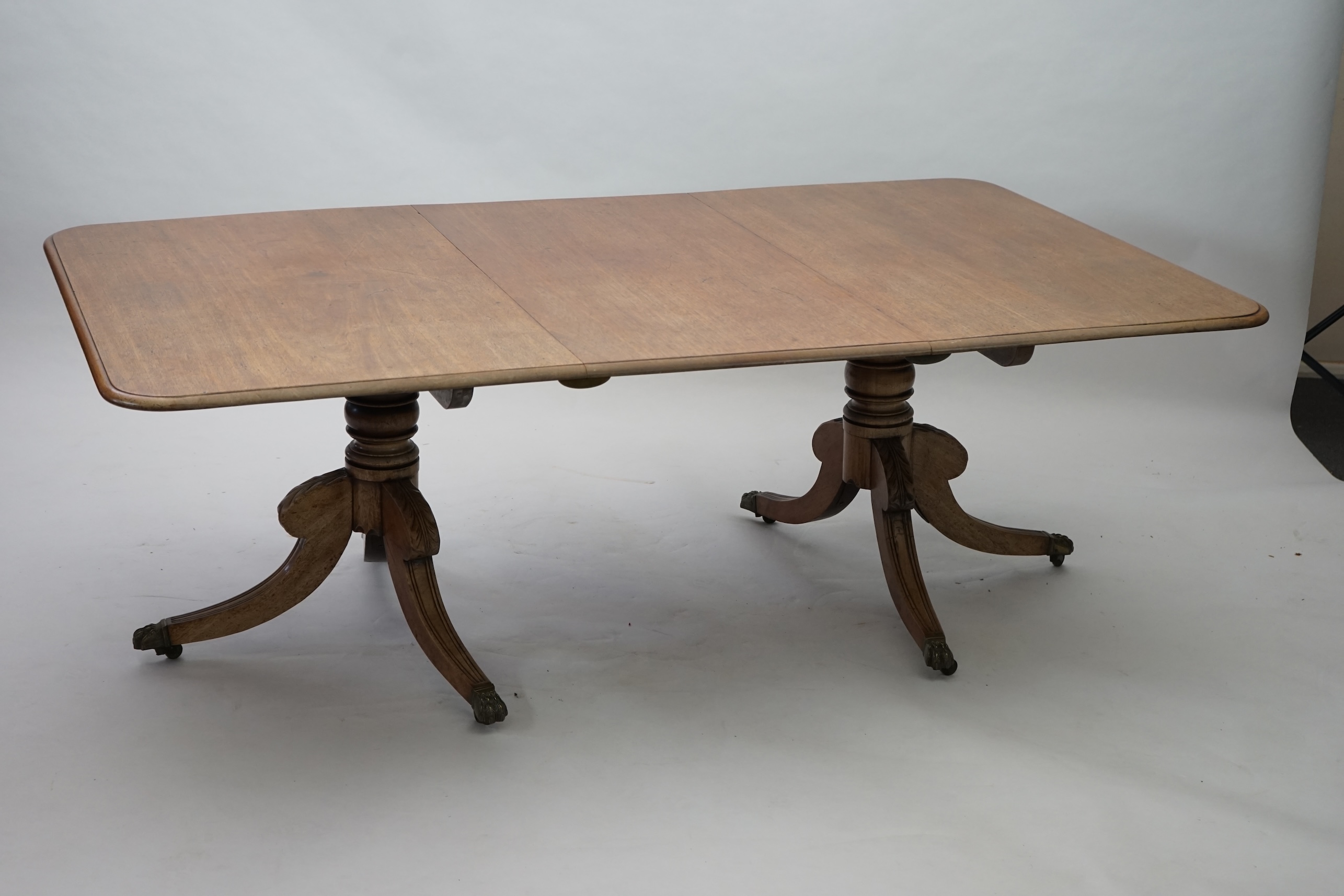 A Regency mahogany extending dining table